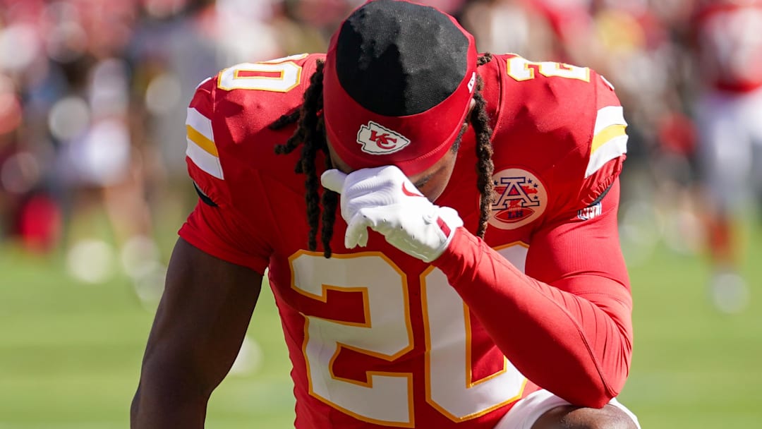 Sep 28, 2025; Kansas City, Missouri, USA; Kansas City Chiefs cornerback Nohl Williams (20) kneels in the end zone against the Baltimore Ravens prior to a game at GEHA Field at Arrowhead Stadium.