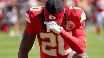 Sep 28, 2025; Kansas City, Missouri, USA; Kansas City Chiefs cornerback Nohl Williams (20) kneels in the end zone against the Baltimore Ravens prior to a game at GEHA Field at Arrowhead Stadium.