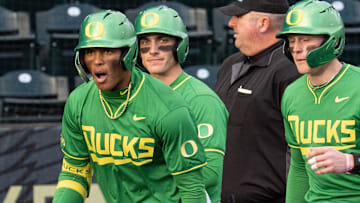 Oregon’s Jacob Walsh, left, celebrates an RBI homer against Toledo at PK Park in Eugene Friday, Feb. 14, 2025.