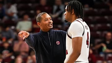 Nov 9, 2025; Columbia, South Carolina, USA; South Carolina Gamecocks head coach Lamont Paris speaks with South Carolina Gamecocks guard Kobe Knox (4) in the first half at Colonial Life Arena. Mandatory Credit: Jeff Blake-Imagn Images