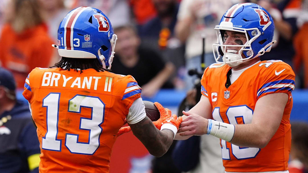 Oct 26, 2025; Denver, Colorado, USA;  Denver Broncos wide receiver Pat Bryant (13) celebrates scoring a touchdown with quarterback Bo Nix (10) in the second quarter against the Dallas Cowboys at Empower Field at Mile High. 
