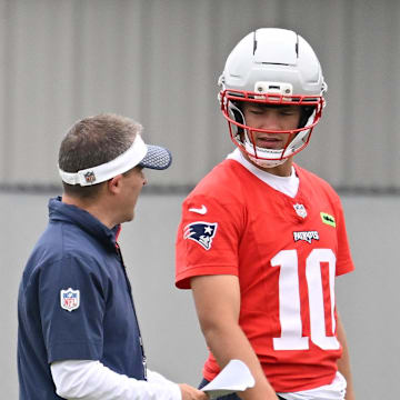 Jun 9, 2025; Foxborough, MA, USA; New England Patriots offensive coordinator Josh McDaniels works with quarterback Drake Maye (10) during minicamp at Gillette Stadium. Mandatory Credit: Eric Canha-Imagn Images