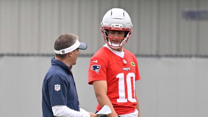 Jun 9, 2025; Foxborough, MA, USA; New England Patriots offensive coordinator Josh McDaniels works with quarterback Drake Maye (10) during minicamp at Gillette Stadium. Mandatory Credit: Eric Canha-Imagn Images