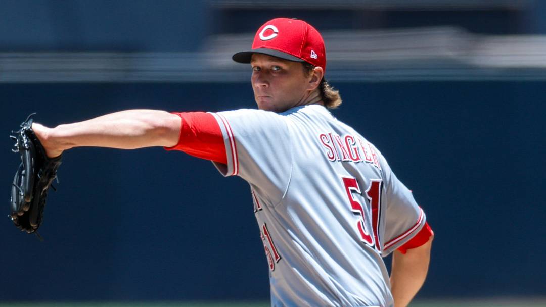 Cincinnati Reds starting pitcher Brady Singer (51) throws a pitch