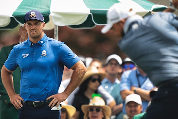 Bryson DeChambeau stands with his hands on his hips during the first round of the Masters.