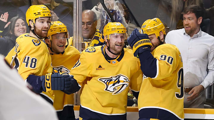 Jan 22, 2026; Nashville, Tennessee, USA;  Nashville Predators center Steven Stamkos (91) celebrates with teammates after scoring a goal and a hat trick against the Ottawa Senators during the third period at Bridgestone Arena. Mandatory Credit: Steve Roberts-Imagn Images