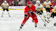 Nov 7, 2024; Raleigh, North Carolina, USA;  Carolina Hurricanes center Jack Roslovic (96) skates with the puck against the Pittsburgh Penguins during the third period at Lenovo Center. Mandatory Credit: James Guillory-Imagn Images
