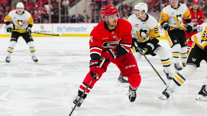 Nov 7, 2024; Raleigh, North Carolina, USA;  Carolina Hurricanes center Jack Roslovic (96) skates with the puck against the Pittsburgh Penguins during the third period at Lenovo Center. Mandatory Credit: James Guillory-Imagn Images