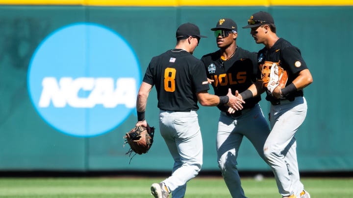 Tennessee's Dylan Dreiling (8), Kavares Tears (21) and Hunter Ensley (9) congratulate each other after game two of the NCAA College World Series finals between Tennessee and Texas A&M at Charles Schwab Field in Omaha, Neb., on Sunday, June 23, 2024.