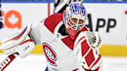 Sep 28, 2022; Toronto, Ontario, CAN; Montreal Canadiens goalie Samuel Montembeault (35) makes a glove save against the Toronto Maple Leafs in the second period at Scotiabank Arena. Mandatory Credit: Dan Hamilton-Imagn Images
