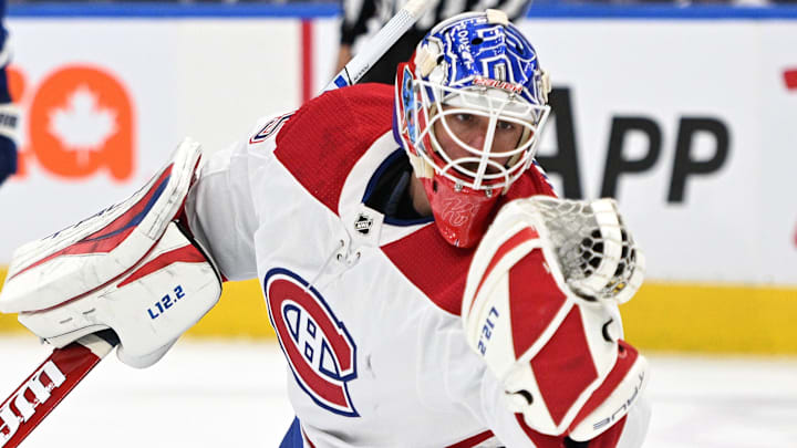 Sep 28, 2022; Toronto, Ontario, CAN; Montreal Canadiens goalie Samuel Montembeault (35) makes a glove save against the Toronto Maple Leafs in the second period at Scotiabank Arena. Mandatory Credit: Dan Hamilton-Imagn Images