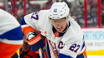 Mar 30, 2025; Raleigh, North Carolina, USA;  New York Islanders left wing Anders Lee (27) watches the play against the Carolina Hurricanes during the third period at Lenovo Center. Mandatory Credit: James Guillory-Imagn Images