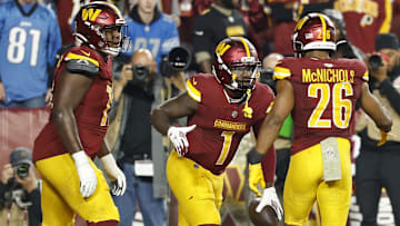 Nov 9, 2025; Landover, Maryland, USA; Washington Commanders wide receiver Robbie Chosen (12) celebrates with Commanders running back Jeremy McNichols (26) after catching a touchdown pass against the Detroit Lions in the third quarter at Northwest Stadium. Mandatory Credit: Geoff Burke-Imagn Images