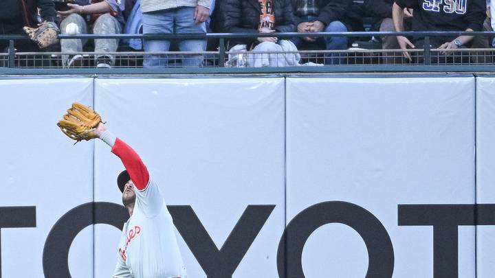 Apr 7, 2026; San Francisco, California, USA; Philadelphia Phillies outfielder Otto Kemp (4) catches a fly ball in left field during the second inning of the game against the San Francisco Giants at Oracle Park. Mandatory Credit: Ed Szczepanski-Imagn Images
