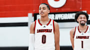 Louisville Cardinals guard Mikel Brown Jr. (0), left, Louisville Cardinals guard J'Vonne Hadley (1) and Louisville Cardinals guard Kobe Rodgers (11) after the Cardinals' media day for the 2025-26 basketball season on Wednesday Oct. 15, 2025 in Louisville, Kentucky.