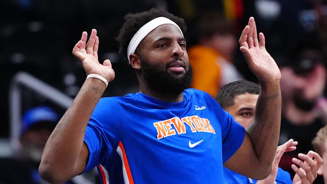 Mar 6, 2026; Denver, Colorado, USA; New York Knicks center Mitchell Robinson (23) reacts in the fourth quarter against the Denver Nuggets at Ball Arena. Mandatory Credit: Ron Chenoy-Imagn Images