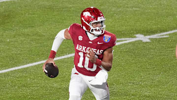 Arkansas' quarterback Taylen Green (10) scrambles with the ball during the AutoZone Liberty Bowl between Arkansas and Texas Tech in Memphis, Tenn., on Friday, December 27, 2024.