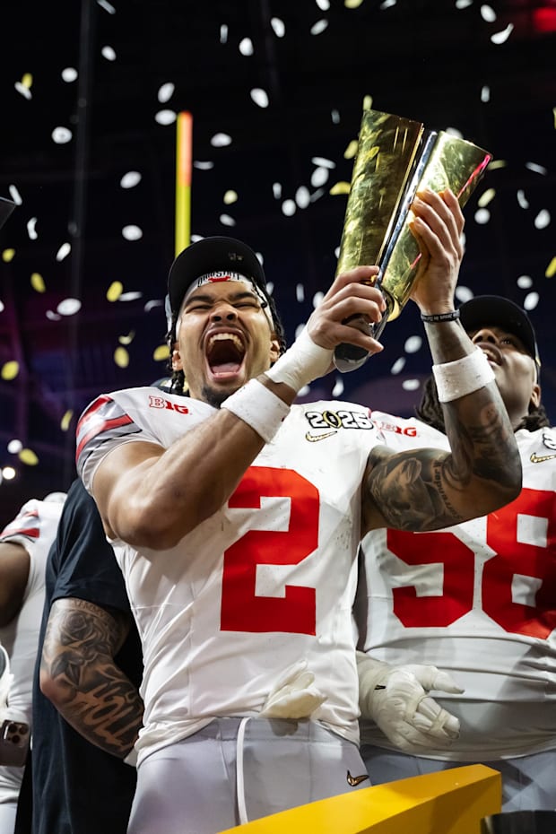 Ohio State Buckeyes wide receiver Emeka Egbuka celebrates with the trophy after defeating the Notre Dame Fighting Irish