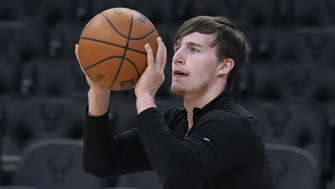 Mar 28, 2025; Milwaukee, Wisconsin, USA; New York Knicks guard Tyler Kolek (13) puts up a shot during pregame warmups before a game against the Milwaukee Bucks at Fiserv Forum. Mandatory Credit: Michael McLoone-Imagn Images