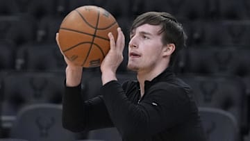 Mar 28, 2025; Milwaukee, Wisconsin, USA; New York Knicks guard Tyler Kolek (13) puts up a shot during pregame warmups before a game against the Milwaukee Bucks at Fiserv Forum. Mandatory Credit: Michael McLoone-Imagn Images