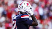 Sep 12, 2025; Tucson, Arizona, USA; Arizona Wildcats running back Ismail Mahdi (21) wears the retro helmet for the start of the game against the Kansas State Wildcats at Arizona Stadium. Mandatory Credit: Aryanna Frank-Imagn Images
