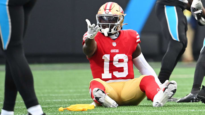 Oct 9, 2022; Charlotte, North Carolina, USA; San Francisco 49ers wide receiver Deebo Samuel (19) reacts after being fouled in the third quarter at Bank of America Stadium. Mandatory Credit: Bob Donnan-Imagn Images