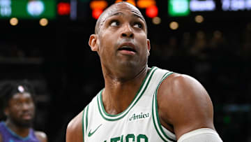 Boston Celtics center Al Horford (42) looks to shoot through the defense of Charlotte Hornets forward Tidjane Salaun (31) during the first half at TD Garden.