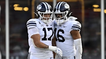 Sep 6, 2024; Dallas, Texas, USA; Brigham Young Cougars linebacker Jack Kelly (17) and linebacker Isaiah Glasker (16) in action during the game between the Southern Methodist Mustangs and the Brigham Young Cougars at Gerald J. Ford Stadium. Mandatory Credit: Jerome Miron-Imagn Images