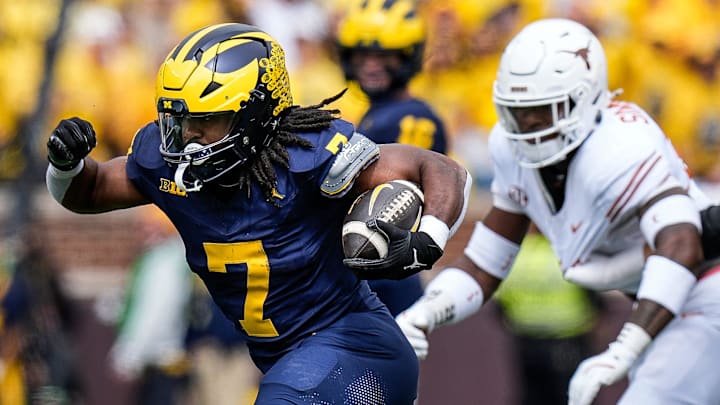 Michigan running back Donovan Edwards (7) runs for a first down against Texas during the first half at Michigan Stadium in Ann Arbor on Saturday, September 7, 2024.