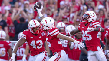 Mekhi Nelson holds the ball aloft after recovering a fumbled kick return by Michigan State late in the third quarter.