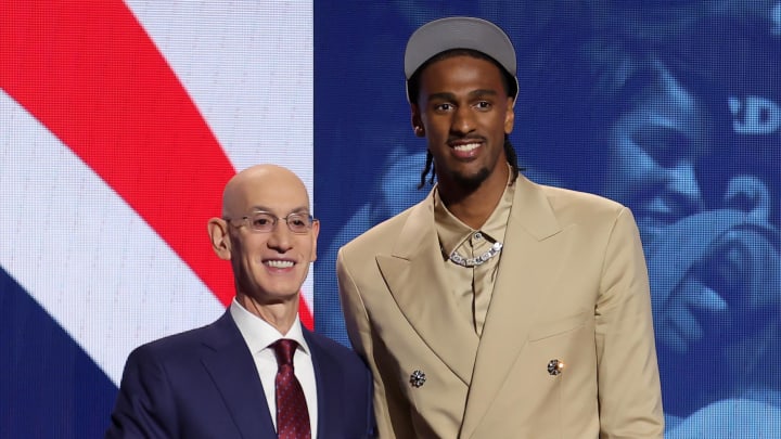 Alexandre Sarr poses for photos with NBA commissioner Adam Silver.