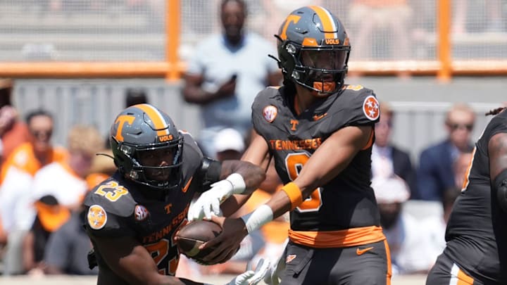 Tennessee quarterback Nico Iamaleava (8) hands the ball off to Tennessee running back Cameron Seldon (23) during a game between Tennessee and Chattanooga, Saturday, Aug. 31, 2024.