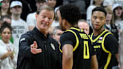 Feb 8, 2025; East Lansing, Michigan, USA;  Oregon Ducks head coach Dana Altman talks to Oregon Ducks guard Ra'Heim Moss (0) during the first half against the Michigan State Spartans at Jack Breslin Student Events Center. Mandatory Credit: Dale Young-Imagn Images