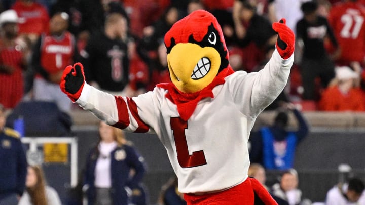 Oct 7, 2023; Louisville, Kentucky, USA; The Louisville Cardinals mascot performs before the team faces off against the Notre Dame Fighting Irish at L&N Federal Credit Union Stadium. 