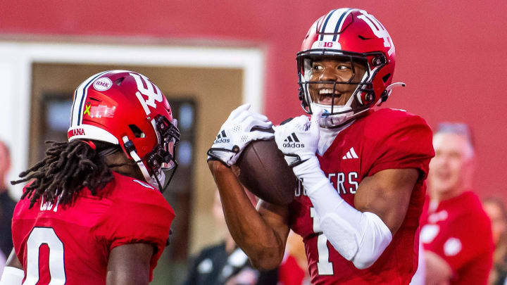 Indiana's Donaven McCulley (1) celebrates his touchdown with Andison Coby (0) during the spring game at Memorial Stadium on Thursday, April 18, 2024.