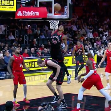 Ochai Agbaji throws it down on teammate Jakob Poeltl. 