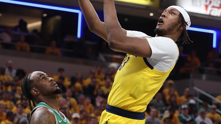 May 25, 2024; Indianapolis, Indiana, USA; Indiana Pacers center Myles Turner (33) shoots the ball against Boston Celtics forward Oshae Brissett (12) during the first quarter of game three of the eastern conference finals in the 2024 NBA playoffs at Gainbridge Fieldhouse. Mandatory Credit: Trevor Ruszkowski-USA TODAY Sports