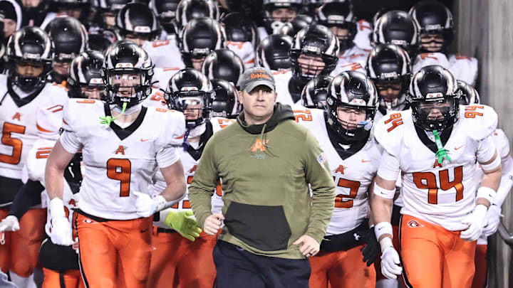 Anderson head coach Evan Dreyer leads his team on the field before their OHSAA Division II state championship game in Canton, Ohio, on Dec. 4, 2025. Dreyer was one of 32 coaches nominated for the 2025 Don Shula High School Coach of the Year award.