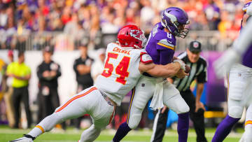Oct 8, 2023; Minneapolis, Minnesota, USA; Kansas City Chiefs linebacker Leo Chenal (54) sacks Minnesota Vikings quarterback Kirk Cousins (8) in the first quarter at U.S. Bank Stadium. Mandatory Credit: Brad Rempel-USA TODAY Sports