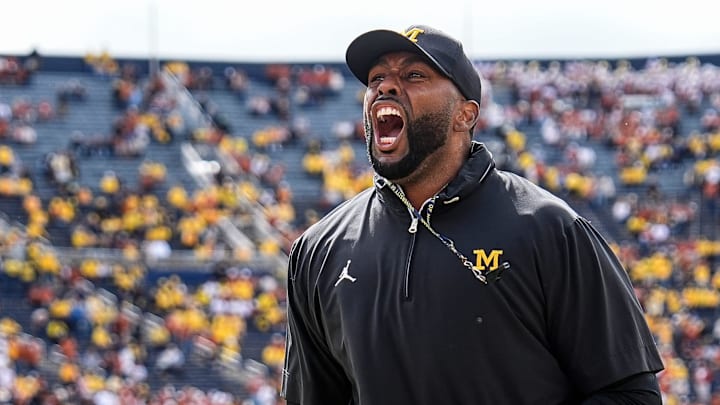 Michigan head coach Sherrone Moore cheer up the student section during warm up before the Texas game at Michigan Stadium in Ann Arbor on Saturday, September 7, 2024.