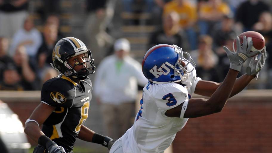 Kansas cornerback Aqib Talib tries to intercept a pass intended in a 2006 game against Missouri.