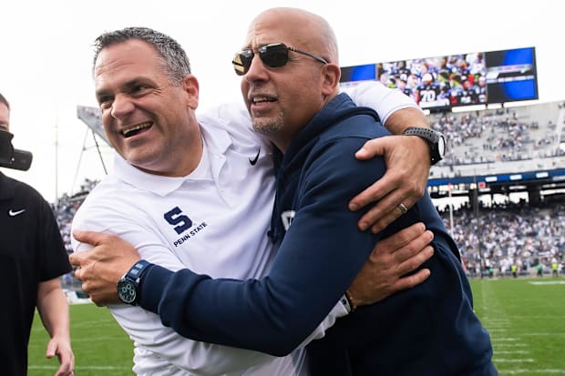 Penn State athletic director Pat Kraft, left, and coach James Franklin celebrate after a 33-24 win over Indiana in 2023.