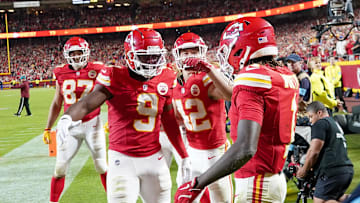 Oct 7, 2024; Kansas City, Missouri, USA; Kansas City Chiefs wide receiver Xavier Worthy (1) celebrates with wide receiver JuJu Smith-Schuster (9) and running back Carson Steele (42) after scoring a touchdown against the New Orleans Saints during the second half at GEHA Field at Arrowhead Stadium. Mandatory Credit: Denny Medley-Imagn Images