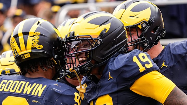 Michigan quarterback Bryce Underwood (19), center, celebrates his touchdown against Central Michigan during the first half at Michigan Stadium in Ann Arbor on Saturday, Sept. 13, 2025.