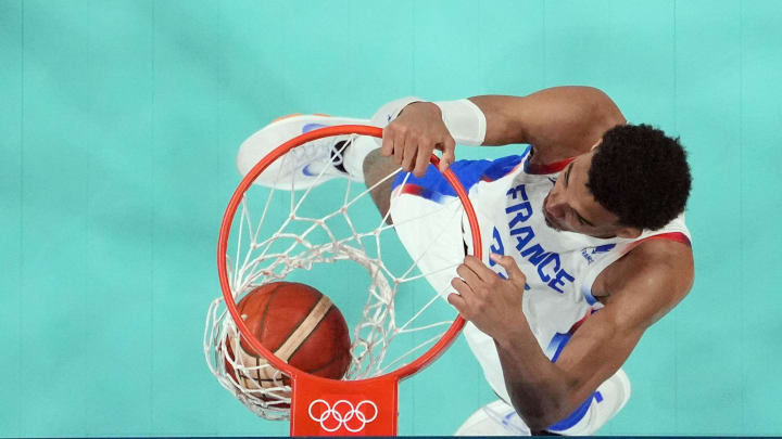 Aug 2, 2024; Villeneuve-d'Ascq, France; France power forward Victor Wembanyama (32) dunks against Germany in the first half in a men’s group B basketball game during the Paris 2024 Olympic Summer Games at Stade Pierre-Mauroy. 