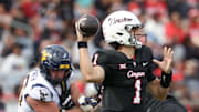 Nov 1, 2025; Houston, Texas, USA; Houston Cougars quarterback Conner Weigman (1) drops back to pass against the West Virginia Mountaineers in the first half at TDECU Stadium. Mandatory Credit: Thomas Shea-Imagn Images