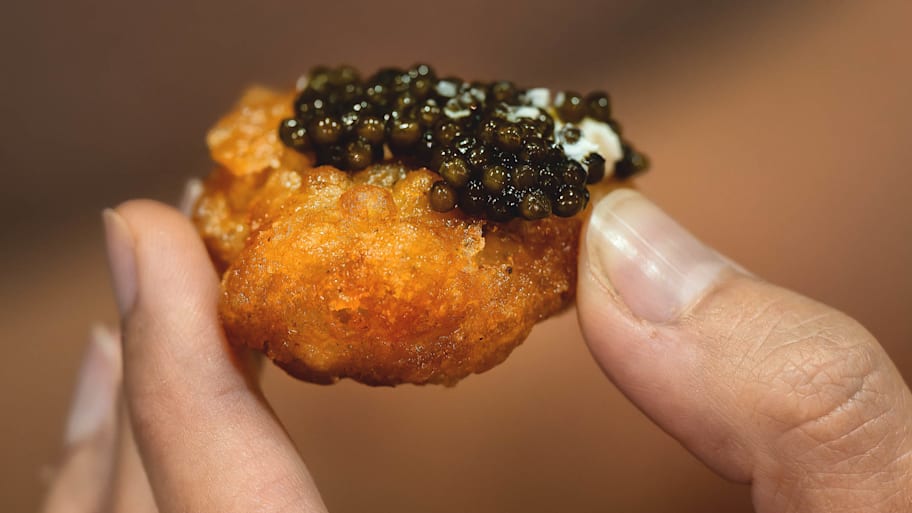 COQODAQ  sold chicken nuggets topped with caviar at this year's U.S. Open.