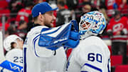 Apr 13, 2025; Raleigh, North Carolina, USA;  Toronto Maple Leafs goaltender Joseph Woll (60) and goaltender Anthony Stolarz (41) celebrate their victory against the Carolina Hurricanes at Lenovo Center. Mandatory Credit: James Guillory-Imagn Images