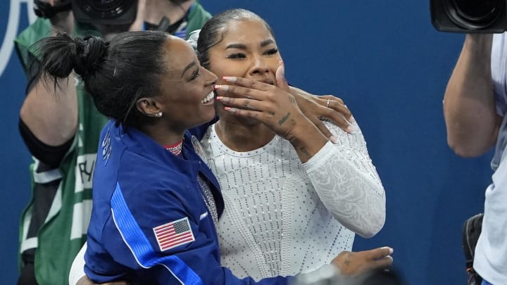 Aug 5, 2024; Paris, France; Jordan Chiles and Simone Biles of the United States celebrate after winning silver and bronze in floor exercise on day three of the gymnastics event finals during the Paris 2024 Olympic Summer Games. 