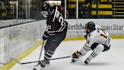 Union's John Prokop takes the puck from UVM's Dawson Good during the Dutchmen's loss to the Catamounts on Saturday evening at Gutterson Fieldhouse.